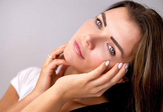 Woman applying serum